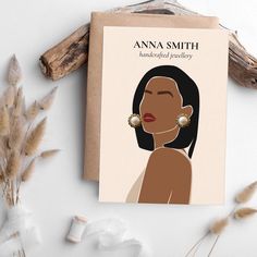 a card with an illustration of a woman's face and earring on it