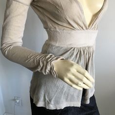 Nwt Vintage Gianfranco Ferre Long Sleeved Deep Plunged V-Neck Peplum Knit Top. Sleeves Have Ruching On Cuffs. Material Is Viscose And Nylon. Feels Like Linen Knit. Would Need To Wear A Bralette Or Camisole Underneath. Oatmeal Color. Size Small. Approx Measurements Laying Flat And Relaxed: Waist 23" (Stretches To About 28", Length From Shoulder 23". Made In Italy * Please Do Not Use My Photos Without Permission Elegant Fitted V-neck Cardigan, Elegant Stretch V-neck Cardigan, Feminine Fitted V-neck Cardigan, Elegant Cream V-neck Cardigan, Elegant Stretch Fine Knit Cardigan, Feminine Fitted Long Sleeve Cardigan, Fitted Long Sleeve Feminine Cardigan, Elegant Fine Knit V-neck Cardigan, Fitted Beige Fine Knit Cardigan