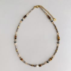 "This Mocha beaded necklace features mixture of cube, rectangular prism and round beads that made of brown, grey and beige natural stones, freshwater pearls and 18k gold plated components. It's perfect to pair with all of your winter outfits, and can also be the perfect gift for your fashion-forward friend or family member who loves layering necklaces with style.  This necklace is unisex, it's a great gift for men that love beaded choker or short necklace. - P R O D U C T - * Length: 38cm + 5cm extension / 15 - 17\"  * Materiel: Natural stones, real freshwater pearls and 18k gold plated. * Every piece is one of a kind: Natural pearls and stones are unique material, they are all different and may have some imperfections, that are often considered part of the beauty of natural gemstones. * H Brown Bead Necklace, Necklace Natural Stones, Labradorite Beaded Necklace, Brown Heishi Beads Necklace For Gift, Brown Heishi Beads Necklace Gift, Gray Jewelry With Colorful Beads For Gift, Men Choker, Winter Necklace, Xmas Gifts For Her