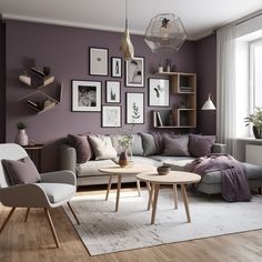 a living room with purple walls and pictures on the wall above the couch, coffee table