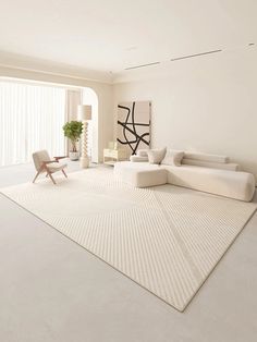 a living room with white furniture and a large rug on the floor in front of a window