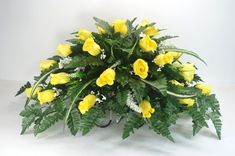 a bouquet of yellow flowers on a white background