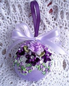 an ornament with purple flowers on it