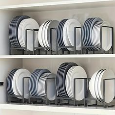 the shelves are full of plates and dishes in black and white colors, with one empty plate on each shelf