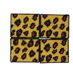 four pieces of yellow and black beaded fabric with leopard print on the side,