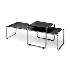 two black tables sitting next to each other on top of a white surface with metal legs