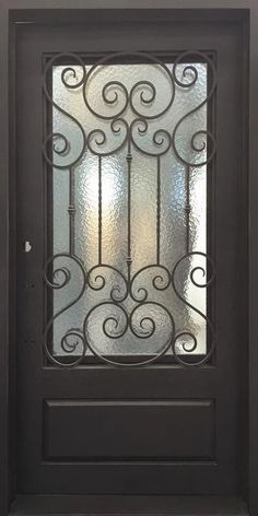 a black door with a glass window and wrought iron grills on it's side