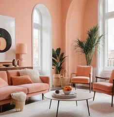 an orange living room with pink walls and white carpeted flooring is featured in this image