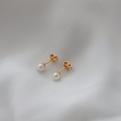 Delicate, mini pearl earrings for your everyday outfits! Cheap Minimalist Pearl Earrings With Charm, Everyday Pearl White Drop Earrings, Pearl White Drop Earrings For Everyday Wear, Classic Everyday Pearl Drop Earrings, Gold Pearl Drop Cartilage Earrings As Gift, Elegant White Cartilage Earrings Gift, Minimalist Pearl Earrings For Pierced Ears, Minimalist Pearl Earrings For Everyday, Delicate Everyday Pearl Earrings For Pierced Ears