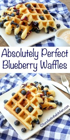 blueberry waffles on a white plate topped with fresh berries and syrup are ready to be eaten