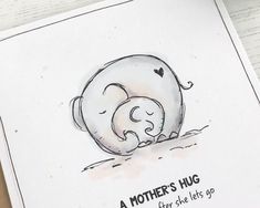 a mother's hug card with an elephant hugging her baby in the middle and text that reads, a mother's hug after she lets go