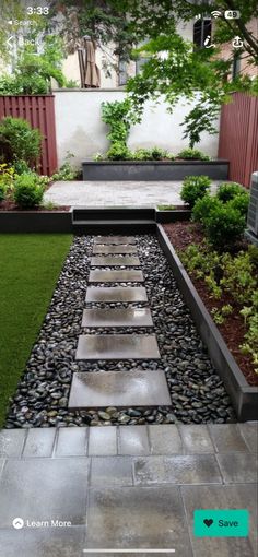 an outdoor garden with grass and stepping stones