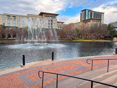 there is a fountain in front of the building