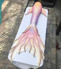 a fake mermaid tail on top of a mattress