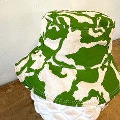 The perfect lightweight bucket hat for sunny spring and summer days! Now available in two sizes (Small/Medium & Large) since we had some issues with these not be consistent last season. Print: 1 color screen print Size: Small/Medium 21-22.5 inches, Large 22.5-23 inches (inside circumference) Material: Cotton, Cotton Canvas Lining Care: Hand Wash Cold. Hang or Lay Flat to Dry. Do not dry in the dryer. Cotton Bucket Sun Hat For The Beach, Cotton Bucket Hat For Beach, Reversible Cotton Bucket Hat For The Beach, Spring Bucket Hat For Beach, Beach Season Bucket Hat, Cotton Bucket Sun Hat For Summer, Reversible Cotton Sun Hat For The Beach, Adjustable Reversible Cotton Bucket Hat, Summer Cotton Bucket Sun Hat