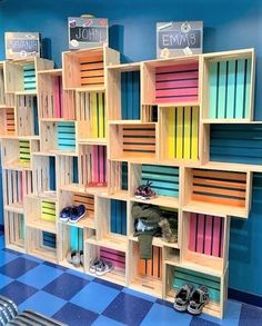 an image of a book shelf with books on it and shoes in the bottom row