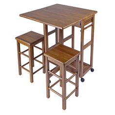 three wooden stools and a table on wheels