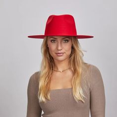 Rancher Vivid | Womens Colored Felt Fedora Hat is perfect for women who want to make a bold statement. Crafted from wool felt with a wide brim, its vibrant colors and sleek design add a pop of style to any look. Material: Wool Felt Shape: Tear Drop Western Trim: No Trim Brim Size: 3 1/2" Crown Height: 4 1/8" Sweatband: Adjustable Velcro Sweatband Imported Red Fedora Felt Hat For Fall, Red Fedora Winter Hat, Red Flat Brim Hat For Fall, Red Fedora With Short Brim For Winter, Red Curved Brim Fedora For Winter, Red Fedora With Short Brim For Fall, Red Short Brim Fedora For Winter, Red Fedora For Winter, Red Winter Fedora With Short Brim