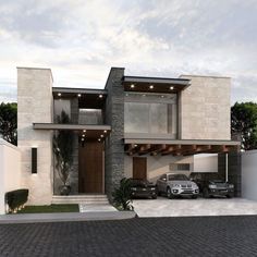 two cars parked in front of a modern house