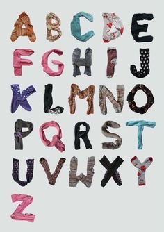 the alphabet is made up of different types of fabric and has letters that spell out