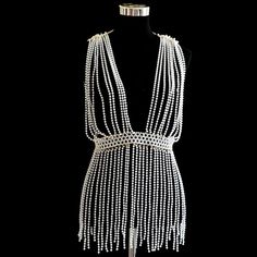 The most elegant attire, perfect for any occasion, is this new dress from your favorite fashion brand. The flattering cut and subtle color palette make it a perfect addition to your wardrobe. Do you wanahavit? Beaded Outfits, Pearl Bags, Body Jewerly, Pearl Pattern, 20s Dresses, Bags Diy, Chain Dress, Coachella Dress, Rave Fashion