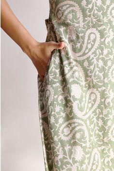 The Alicia shirt midi dress is a springtime staple. Crafted with care from cotton, its charming block print adds flair to its warm green shade. Featuring a collared design and front button closure, this jade short-sleeve maxi dress exudes casual elegance. With two handy pockets, it's as practical as it is stylish, making it perfect for effortless chic on sunny days.Material: Cambric - 100% cottonStyle/Print: Hand Block PrintNumber of Pockets: 2Length: 45 inchesOccasion: CasualColor: Jade Casual Light Green Cotton Dress, Modest Green Spring Maxi Dress, Cotton Short Sleeve Maxi Dress For Daywear, Green Cotton Maxi Dress, Green Cotton Midi Dress For Daywear, Green Bohemian Cotton Midi Dress, Fitted Modest Cotton Maxi Dress, Modest Green Maxi Dress For Summer, Spring Daywear Dresses With Block Print