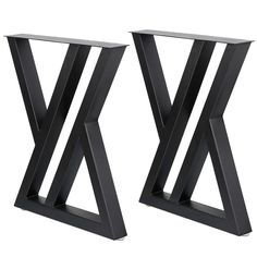 pair of black metal side tables on white background