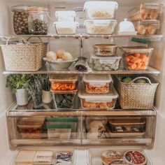 an open refrigerator filled with lots of food and containers full of vegetables, eggs, meats, and more