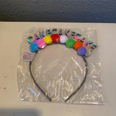 a headband with pom - poms on it