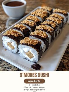 there is a sushi on the plate with chocolate and marshmallow toppings