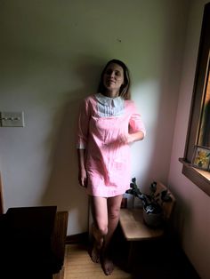 Up for sale is a vintage 1960's to 1970's striped, collared dress in pink and white, approximately size S. Overall the garment is in great condition for its age though it does have various wear present, such as minor spots of discoloration (see photos). There is a little tear on the back collar but it cannot be seen when worn owing to the collar being folded over. Most of the discoloration can be seen on the white trim/accents. Despite the minor flaws, this is a beautiful piece with many years o Casual Pink Vintage Dress With Short Sleeves, Casual Pink Short Sleeve Vintage Dress, Pink Vintage Dress For Daywear, Pink Collared Cotton Dress, Pink Cotton Collared Dress, Pink Collared Dresses For Spring, Pink Long Sleeve Vintage Dress For Summer, Casual Pink Vintage Dress For Spring, Pink Retro Dress With Peter Pan Collar