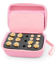 a pink case filled with lots of cupcakes