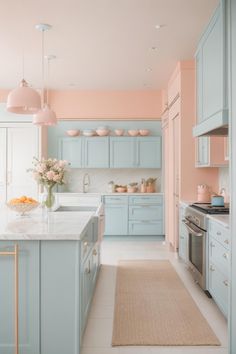 a kitchen with light blue cabinets and white counter tops, along with an area rug on the floor