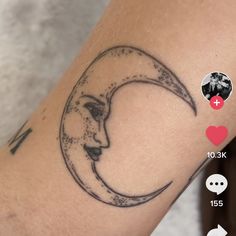 a woman's arm with a tattoo on it and the moon in the middle