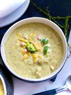 a bowl filled with broccoli and cheese soup