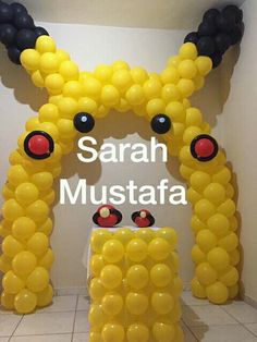 an arch made out of balloons in the shape of pikachu's head