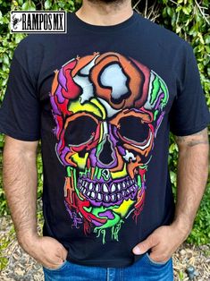 Handmade Serigraphy Print, Mexican Mens T-Shirts Graphic Tees that are super stylish , bright and glow in Blacklight , Neon Lights, Mexican Art Skull shirts , made by Artisans in Mexico in several designs . Mexican men Shirts. Short sleeve Men's apparel made of ultrasoft 100% cotton, this comfortable style is designed with a classic crew neckline, short sleeves and relaxed Fit, Our t-shirt is a perfect gift for that special person near you.  Please check the Product images for Size measurements guide Follow us in Instagram and Facebook: @RamposMX Multicolor Top With Screen Print For Artistic Expression, Multicolor Band Merch Top With Graphic Design, Fun Black T-shirt With Sublimation Print, Multicolor Skull Print Tops For Halloween, Rave Tops With Graphic Print For Halloween, Multicolor Graphic Design Top Band Merch, Multicolor Sublimation Print Band Merch Top, Black Cotton Top With Glow In The Dark Details, Multicolor Band Merch T-shirt With Graphic Design