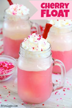 two glasses filled with ice cream and sprinkles on top of a table