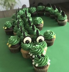 cupcakes with green frosting and googly eyes