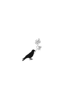 a black and white photo of a bird with flowers in it's beak