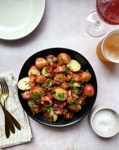 a plate full of potatoes and other food on a table