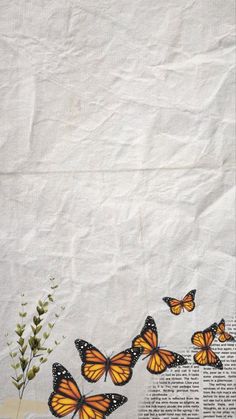 an old newspaper with some butterflies on it and flowers in the middle next to it