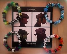 Hand made bracelets inspired by Gorillaz. Each bracelet's color palette is inspired by the corresponding band member. The Gorillaz, Bracelets Kandi, Made Bracelets, Music Bracelet, Free Printable Calendar Templates, Inspired Bracelets, Diy Kandi Bracelets, Pony Bead Bracelets, Diy Kandi