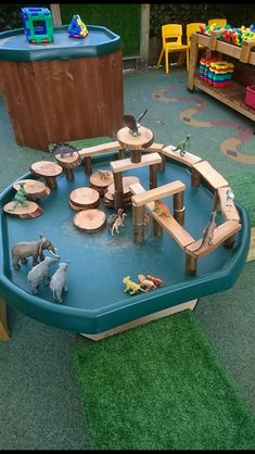 an outdoor play area with toys in it