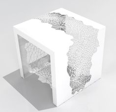 a white box with an intricate design on it