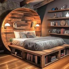 a bedroom with a bed made out of wooden planks and shelves on the wall