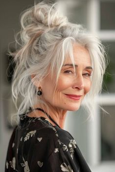 "Silver Hair Beautifully" delves into the timeless allure of silver-haired individuals, celebrating their elegance and confidence How To Do A Messy Bun, Trending Haircuts For Women, Messy Bun For Short Hair, Curly Shag Haircut, Bun Style, Textured Lob, Beautiful Gray Hair, Silver Sisters, Blow Dry Hair