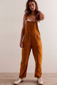 Found: your perfect overalls from our We The Free collection. **Fit:** Slouchy, loose bib-and-brace silhouette **Features:** Utility pockets throughout, adjustable brace straps, dropped armholes, soft rigid denim **Why We ❤ It:** Off-duty with sporty sneakers or elevated with a billowy blouse, this pair has endless ways to wear. | We The Free Way Back Overalls at Free People in Orange, Size: XS - TALL Billowy Blouse, Sporty Sneakers, Utility Pockets, Jean Overalls, Bib Overalls, Jumpsuit Fashion, Dungarees, Off Duty, Boho Outfits