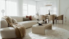 a living room filled with furniture and white walls