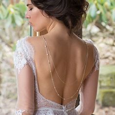 the back of a woman's dress is shown